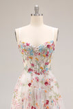 Robe de soirée longue ivoire ligne A bustier transparent brodée de fleurs avec fente et volants