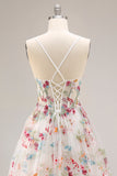 Robe de soirée longue ivoire ligne A bustier transparent brodée de fleurs avec fente et volants
