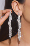 Boucles d’oreilles longues en argent scintillantes avec franges