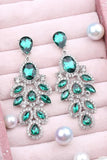 Longues boucles d’oreilles de bal en forme de feuille vert foncé scintillantes avec des strass