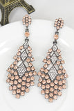 Boucles d’oreilles en forme de larme au champagne scintillant avec des strass