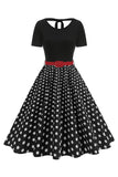 Robe des années 1950 à col rond noir à pois noirs