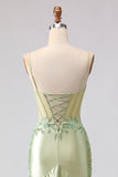 Robe de soirée sirène longue bustier perlé vert clair à volants et dos lacé