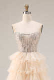Robe de bal longue abricot à bretelles fines rangée de perles et paillettes