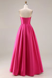 Élégante robe de bal longue de bal rose vif en style A-line bustless bustless et plissée en satin