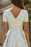 Robe d'invitée de mariage midi imprimé floral bleu et blanc ligne A manches courtes