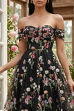 Robe d'invitée de mariage midi noire tulle ligne A bustier floral épaules dénudées appliqué