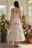 Robe d'invitée de mariage midi noire tulle ligne A bustier floral épaules dénudées appliqué