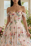 Robe d'invitée de mariage midi noire tulle ligne A bustier floral épaules dénudées appliqué