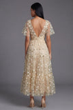 Robe d'invitée de mariage champagne tulle brodé col V manches fluides imprimé floral