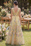 Robe longue fleurie brodée en tulle jaune à col en V