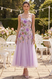 Robe midi fleurie brodée en tulle lilas à col carré brodé