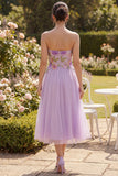 Robe midi brodée fleurie brodée en tulle lilas bretelles