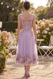 Robe midi fleurie midi brodée en tulle lilas à col en V