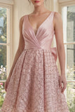 Robe midi à fard à joues étincelante à col V avec un large nœud
