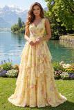 Robe de bal longue jaune fleurie, col en V, volants et nœud
