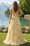 Robe de bal longue jaune fleurie, col en V, volants et nœud