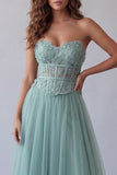 Corset vert bustier Une robe formelle appliquée en tulle à la ligne