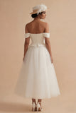 Robe de mariée bohème longue à large épaule blanche décollée A