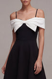 Robe cocktail en ligne A à épaules froides noire et blanche avec nœud