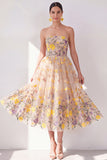 Robe midi fleurie brodée en tulle abricot bretelé
