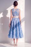 Robe midi fleurie bleue à col rond appliquée avec nœud