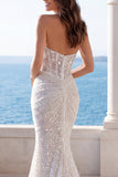 Robe de mariée sirène en ivori de dos nus et paillettes froncées