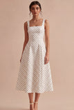 Robe à pois midi à bretelles blanches et noires