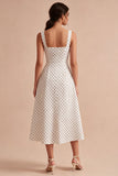 Robe à pois midi à bretelles blanches et noires