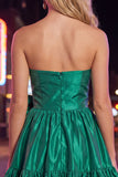 Robe de bal sans bretelles vert foncé à volants en A avec nœud