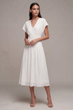 Petite robe blanche en mousseline en mousseline en V