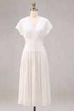 Petite robe blanche en mousseline en mousseline en V