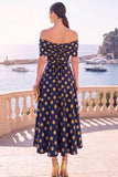Robe midi en ligne A à fleur vert marine décollée sur l’épaule avec lacet dans le dos
