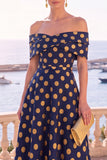 Robe midi en ligne A à fleur vert marine décollée sur l’épaule avec lacet dans le dos