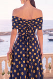 Robe midi en ligne A à fleur vert marine décollée sur l’épaule avec lacet dans le dos