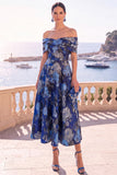 Robe midi en ligne A à fleur vert marine décollée sur l’épaule avec lacet dans le dos