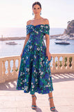 Robe midi en ligne A à fleur vert marine décollée sur l’épaule avec lacet dans le dos