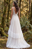Robe longue de mariée ivoire à bretelles fines à volants