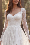 Robe de mariée en dentelle à manches longues en ivoire avec fente