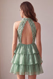 Robe cocktail courte verte à volants à niveaux avec franges