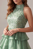 Robe cocktail courte verte à volants à niveaux avec franges