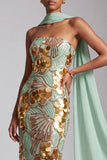 Robe de bal longue de bal sans bretelles dorées à paillettes avec drapé en chiffon