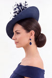 Chapeau fascinator en tissu Sinamay vert foncé avec plume