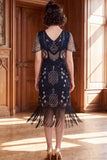 Robe des années 1920 à manches courtes abricot à col V avec paillettes et franges