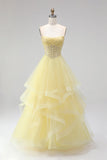 Robe de soirée longue jaune ligne A sans bretelles avec corset, perles et volants à étages