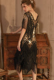 Robe noire scintillante à manches courtes dorées à paillettes à paillettes Gatsby des années 1920 avec franges