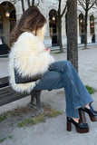 Manteau blanc en fausse fourrure shearling à l’avant ouvert