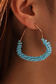 Boucles d’oreilles asymétriques bleues