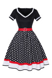 Robe noire à col V à pois des années 50