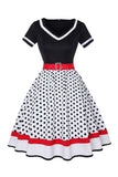 Robe noire à col V à pois des années 50